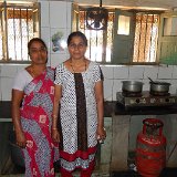 Nirmala (on Right) and helper in kitchen.JPG
